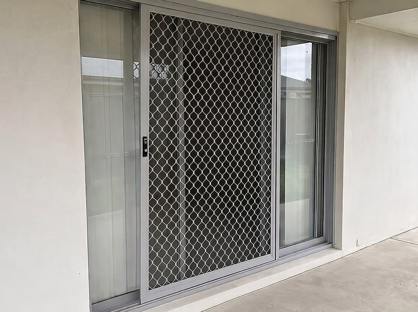 New sliding security screen hung square with taut mesh and a keyed lock