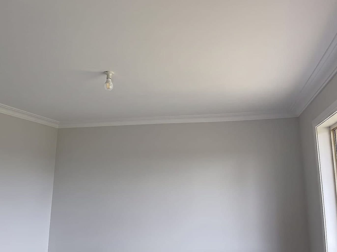 The same ceiling re-sheeted, set flat, cornice back up and repainted